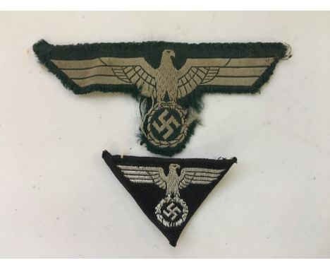 A German Third Reich Berlin SA Wehrmannschaft side cap  machine woven badge together with an Army BeVo national emblem