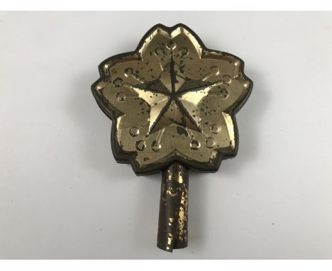An Imperial Japanese tinplate banner staff finial