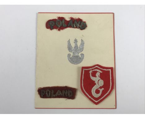 Three items of Second World War Free Polish Army cloth insignia together with a related card