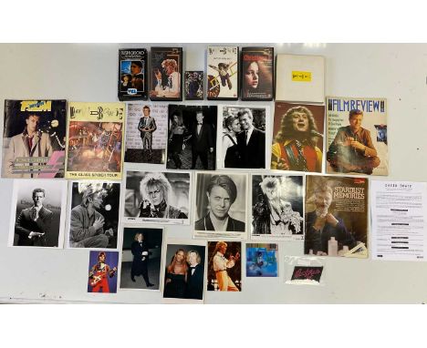 An assortment of David Bowie memorabilia to include: original circa 1970s patch, Glass Spider tour programme, 11 assorted pre