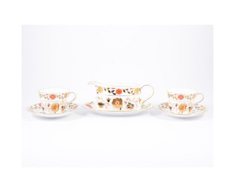 A modern Royal Crown Derby tea service, a stylised Imari pattern, seven tea cups and saucers, six side plates, a gravy boat a