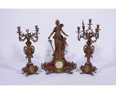 19th Century French mantel garniture, variegated marble and bronzed spelter, comprising a clock, surmounted with a figure of 