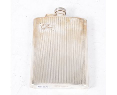 A Mappin &amp; Webb silver hip flask, vertical engine turned line design, hinged bayonet cap, body 13cm x 9.5cm, hallmarked B