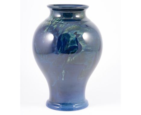 A Royal Worcester "Sabrina Ware" baluster vase, blue ground with trees and peacocks, 25cm high, number 2476