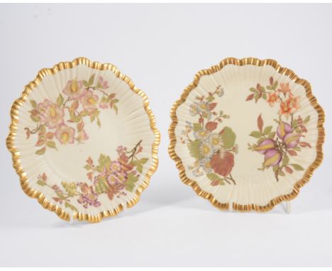 Two similar Royal Worcester cabinet plates, circa.1890, lightly fluted, decorated with flowers, on an ivory coloured ground, 