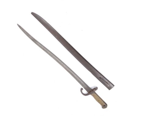 Bayonet with metal scabbard, shaped blade, brass grip, 70cm.