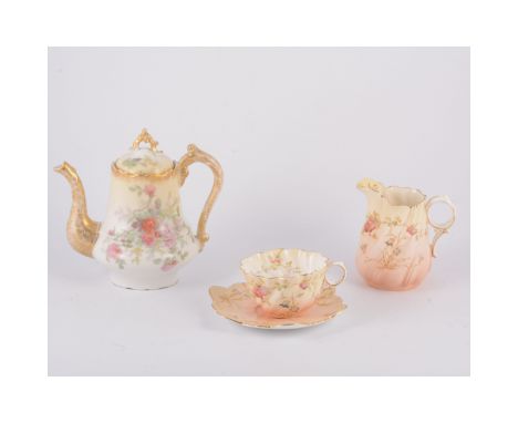 A Limoge floral coffee service with rectangular tray, fluted design painted with flowers and gilt highlights, a floral blush 