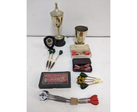 Darts related items to include a silver plated trophy on a plinth, a boxed set of vintage 'Flyrite' darts, a Courage and Co s