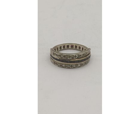 A white metal ruby, sapphire and paste stone full eternity day and night ring, A/F, tested as 9ct, 5.8g.Location: If there is