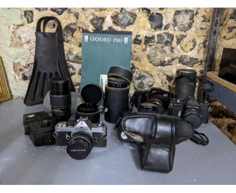 A mixed lot to include a German porcelain figural table lamp with fabric shade, various film cameras to include a Pentax Asah
