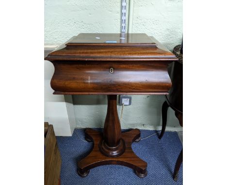 A Regency mahogany pedestal teapoy on quatrefoil base with turned feet, hinged top revealing a fitted interior, 78cm high Loc