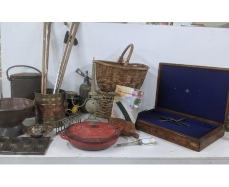 A mixed lot mostly metalware to include a cream can, a copper and brass planter/bucket with twin lion head handles, a cast ir
