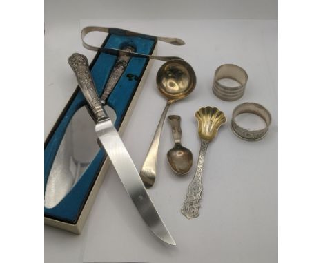 Silver to include a sauce ladle, tea caddy spoon with a floral pierced terminal and a pair of sugar tongs and other items tot