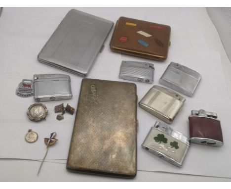 A mixed lot to include a silver plated engine turned cigarette case having gilt interior , together with a group of lighters 