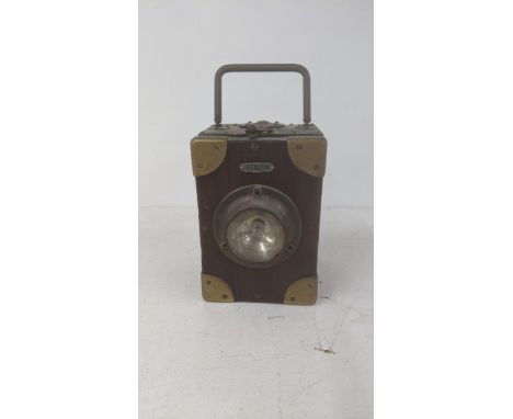 An 20th century Ever Read Brass mounted mahogany and signal lamp with brass handle A/FLocation 2.1If there is no condition re