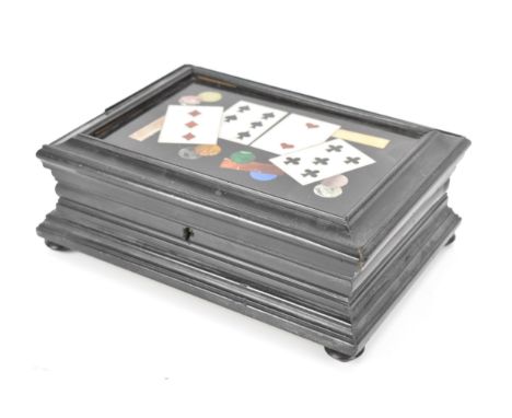 A 19th century pietra dura ebonised wood games box, the rectangular top inset with a black slate panel inlaid with four king 