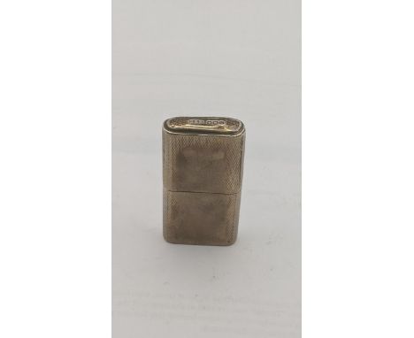 An George VI Howith silver petrol lighted with engine turned decoration and marked 'The Howith Lighter' to the base Sheffield