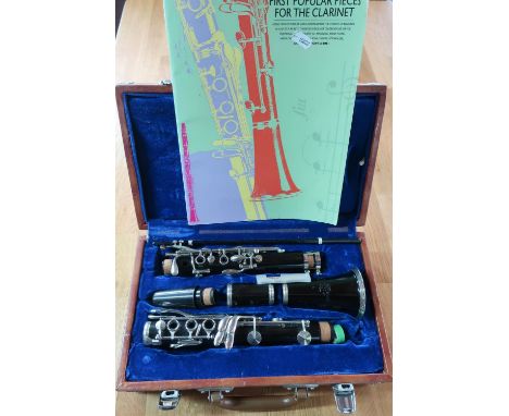 Lark M4001 clarinet in fitted case, and a clarinet tunes book 