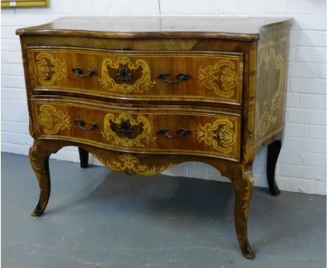 A mahogany and inlaid commode, the serpentine top over two long drawers, raised on sabre leg supports, 90 x 122cm 