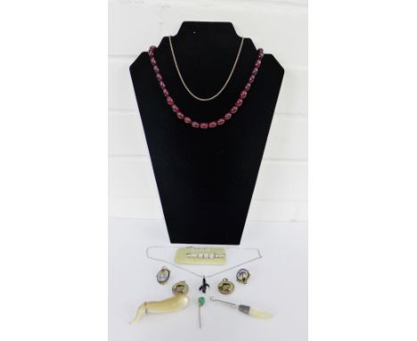 A mixed lot to include a yellow metal mounted shell brooch, amber coloured beads, enamel brooch, hardstone set tiepin, pendan