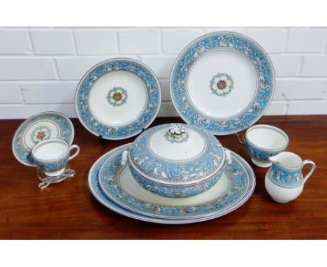 A Wedgwood 'Florentine' patterned dinner service comprising six dinner plates, six bowls, six side plates, six larger bowls, 