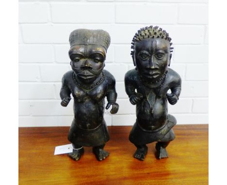 Two Benin bronze figures, circa. mid 20th century, of a male and female, each modelled standing, 45cm high