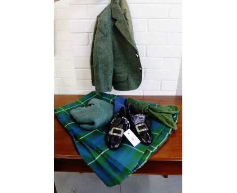 A boys full highland outfit retailed by Aitken & Niven of Edinburgh comprising green wool jacket, kilt, jumper - size 24", gr