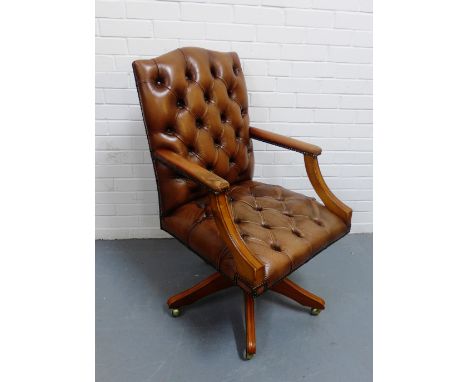 A brown leather button back desk chair, 106 x 62cm 