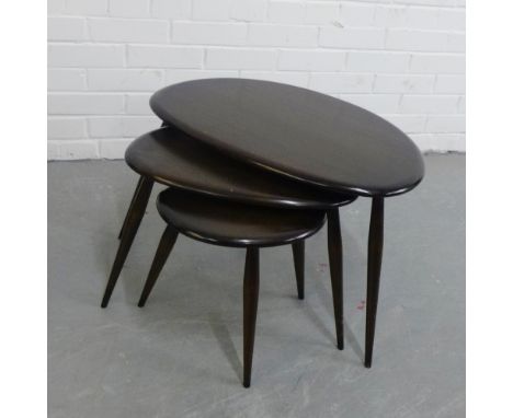 An Ercol pebble nest of three tables, 40  x 65cm (3) 