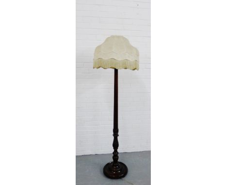 A mahogany standard lamp and shade, 185cm