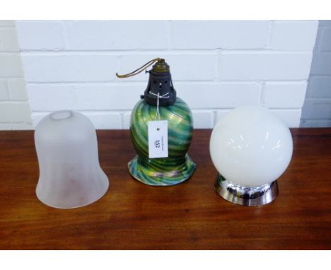 An iridescent swirling glass shade, an opaque glass shade and a small table lamp (3) 