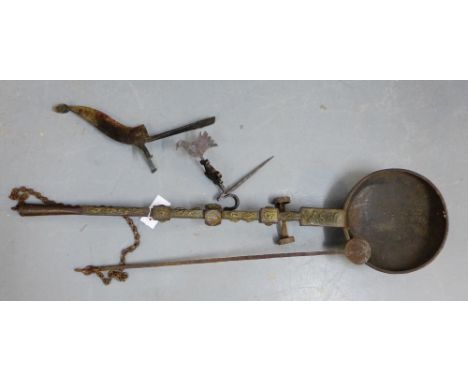 An Ashanti bronze gold smelting pan, 93cm long,  together with two iron sculptures (3) 