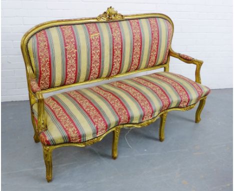 A giltwood framed sofa with striped upholstered back and seat, on cabriole supports, 110 x 165cm 