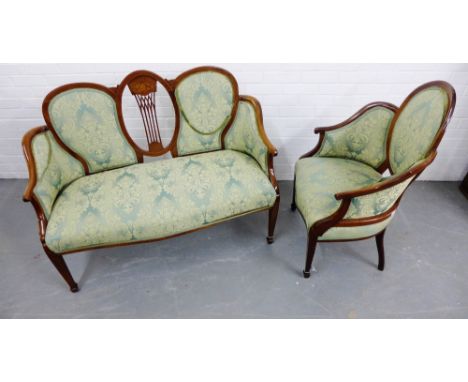 An Edwardian walnut and inlaid parlour sofa with central vertical splat back and upholstered back, arms and seat, on tapering