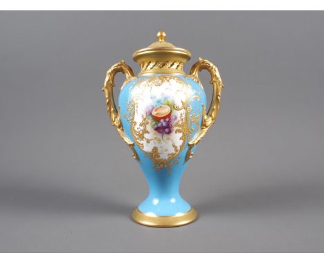 An early 20th century Royal Worcester two-handle vase and cover with fruit decorated panel on a blue celeste ground with gilt