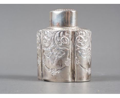 A silver quatrefoil lobed tea caddy with embossed swag and scrolled decoration, 3 1/8" high, 2.1oz troy