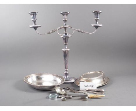 A silver plated three-light candelabra, 18" high, an entree dish, a cutlery tray and various loose plated cutlery