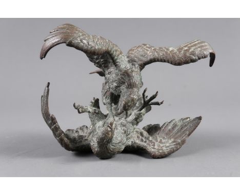 A detailed bronze model of two fighting eagles, 3 3/4" high (said to be a WWI German air ace Honour of Victory trophy)