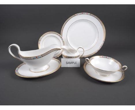 A Spode bone china "Golden Trellis" pattern part dinner service for twelve, including soup cups and stands