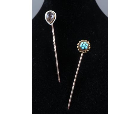 A Victorian yellow metal stick pin cluster, set seven turquoise and a yellow metal stick pin with pink topaz and enamelled fi
