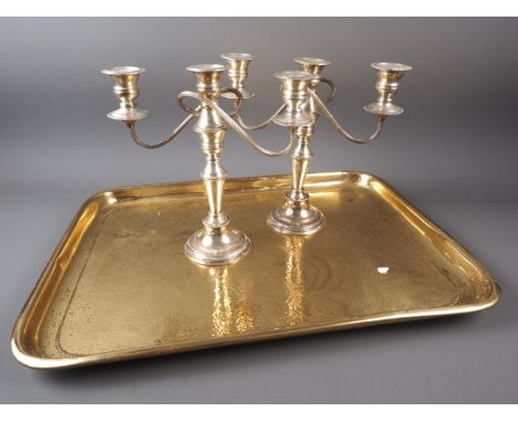 A hammered brass rectangular tray, 24" wide, and a pair of plated three-light table candelabra, 8" high