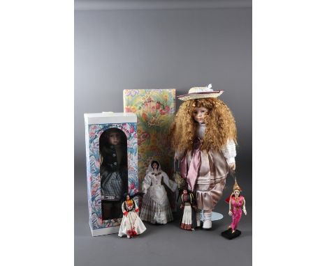 A "Knightsbridge Collection" porcelain headed doll, in box, and other dolls