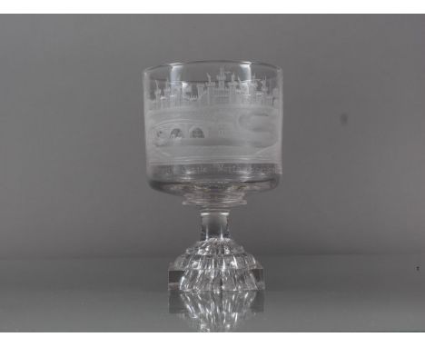 An early 19th century goblet wheel engraved with Alnwick Castle Northumberland and monogram JW, on lemon squeezer base, 5.8" 