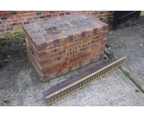 An officer's metal bound strong box, stencilled "A Jacob RE", 36" wide x 21" deep x 21" high, and a fender curb