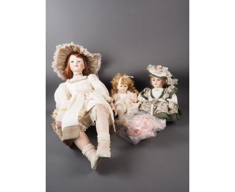 A Leonardo Collection porcelain head doll, named Hannah, another named Charlotte and two other similar dolls