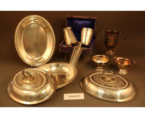 A quantity of silver plate, including a Georgian two-handled cup, 5 1/4" high, various canteens of cutlery, an entree dish, a