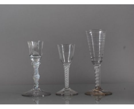 A cordial glass with double cotton twist stem, 5.3" high, a cut down wine glass with rose design and double knopped cotton tw