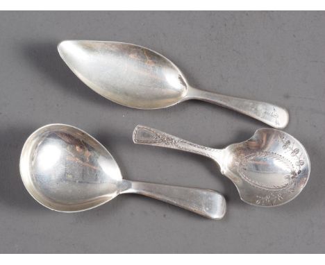A Georgian silver bright-cut caddy spoon, by Joseph Willmore, another Georgian silver caddy spoon and a Victorian silver cadd