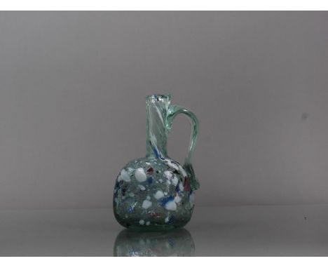 A 19th century Nailsea glass jug, 6" high