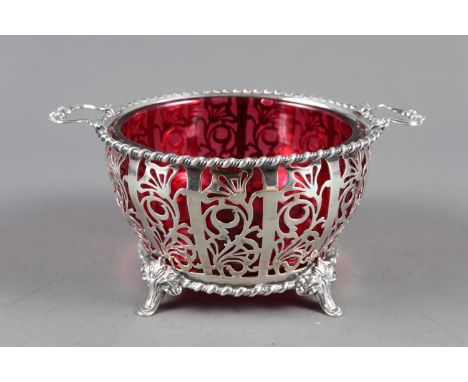 A Mappin &amp; Webb pierced silver sugar basket with ruby glass liner, 3.8oz troy